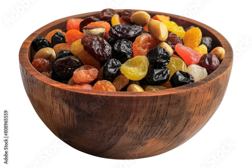 Mix of organic dry fruit in a wooden bowl isolated on transparent background