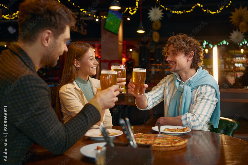 Group of friends football fans rest in sport bar