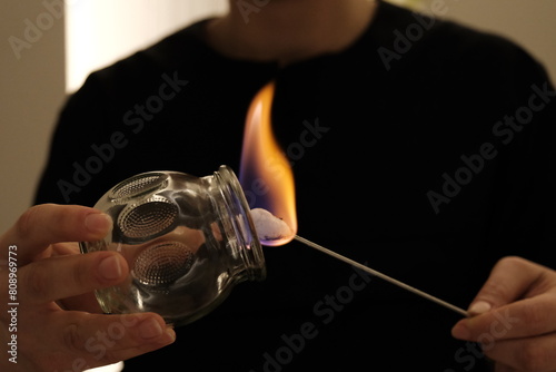 physiotherapist burns cupping cup for cupping therapy