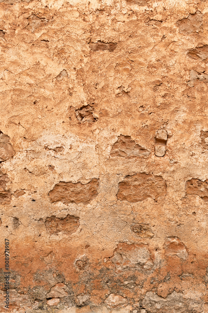 Detailed structure of an old weathered ochre-colored Mediterranean wall - 8814