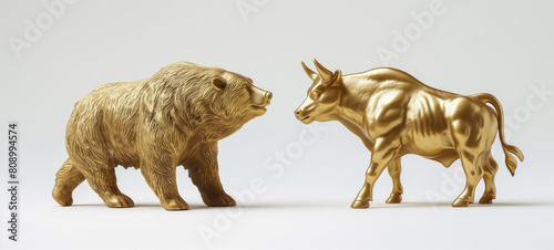 Golden bear and bull statues representing stock market trends