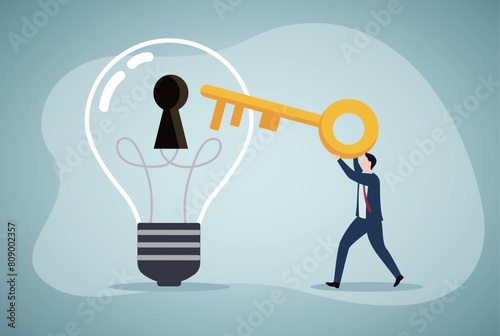 Unlock new business idea, invent new product or creativity concept, smart businessman holding golden key about to insert into key hold on lightbulb idea lamp.