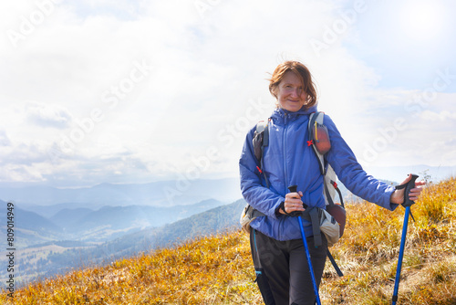 girl tourist on the background of a mountain landscape
