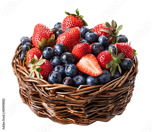 Ripe strawberries and blueberries nestled in a woven basket, isolated on a white background

