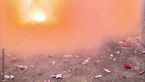 Reverse and slow motion of a cracker releasing extreme fire and smoke