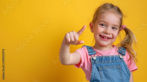 Cheerful Girl Pointing with Finger