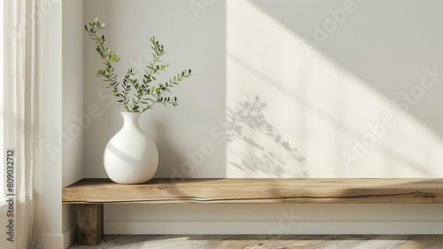 Design a minimalist entryway featuring a sleek white vase on a rustic wooden console, accented with a simple green plant, embodying a clean, welcoming atmosphere. photo