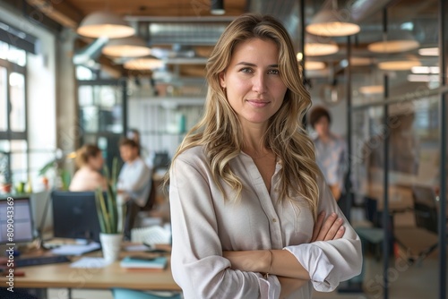 Successful businesswoman standing in creative office