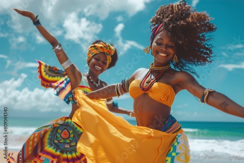 Two beautiful black girls dancing on the beach