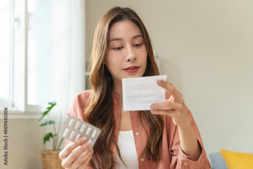 Mindful Health Habits: Engaging in Informed Wellness - A Person Deliberates Supplement Information Before Consumption for Optimal Nutritional Awareness and Personal Well-being. Mindful Health Habits: Engaging in Informed Wellness - A Person Deliberates Supplement Information Before Consumption for Optimal Nutritional Awareness and Personal Well-being.