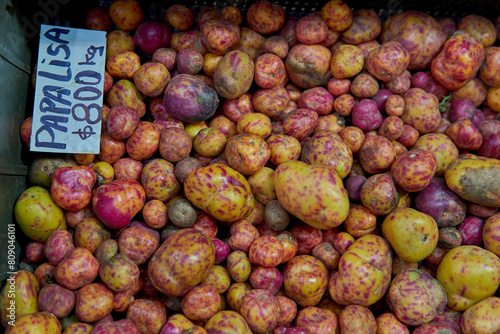 Organic Ulluku, papa lisa with its price in argentine peso at a market in Salta, Argentina. Native potato photo