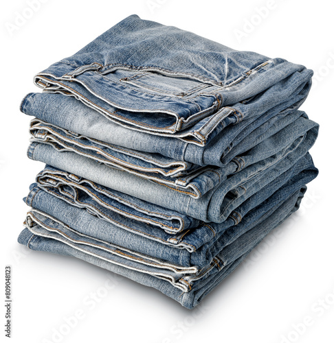 Stack of folded aged blue denim jeans