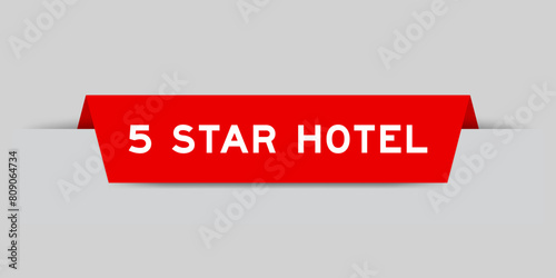 Red color inserted label with word 5 star hotel on gray background