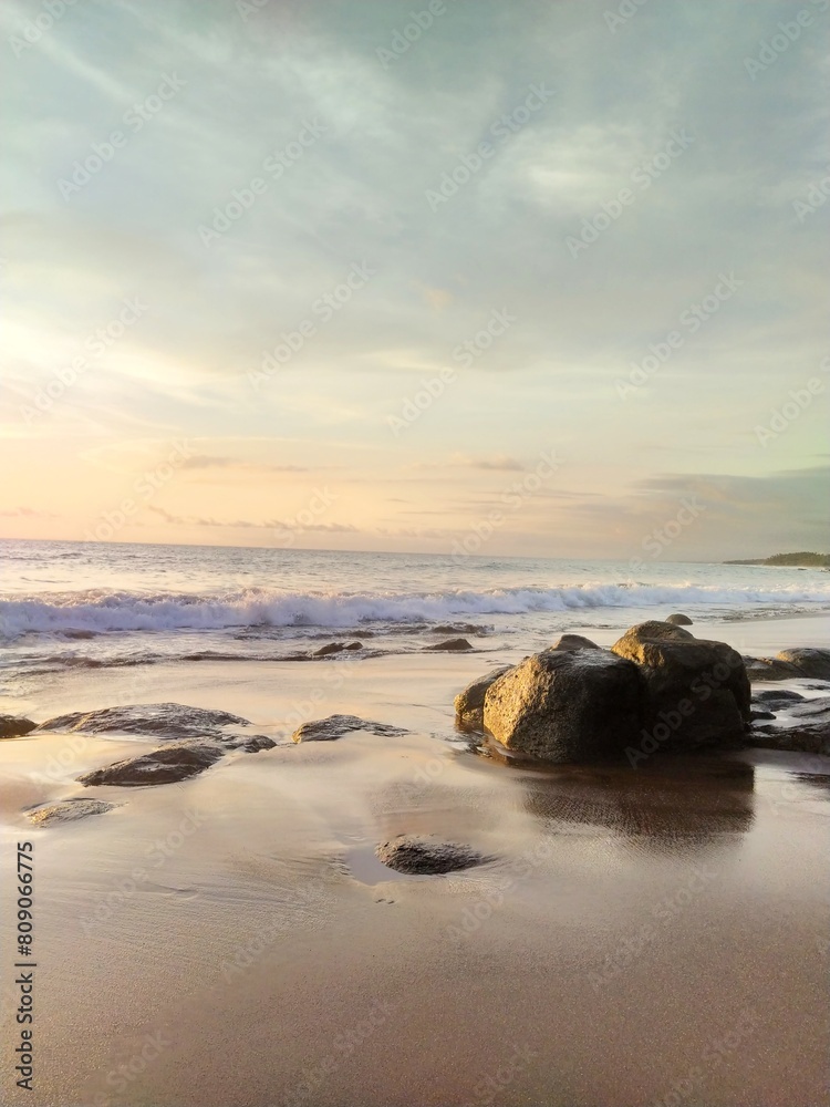 Yellow-orange sunset and sunrise on the ocean shore, Bali island. Epic sunrise, sandy beach. Landscape of Indonesia Yellow-orange sunset and sunrise on the ocean shore, Bali island. Epic sunrise, sandy beach. Landscape of Indonesia