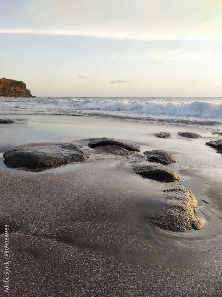 Yellow-orange sunset and sunrise on the ocean shore, Bali island. Epic sunrise, sandy beach. Landscape of Indonesia Yellow-orange sunset and sunrise on the ocean shore, Bali island. Epic sunrise, sandy beach. Landscape of Indonesia