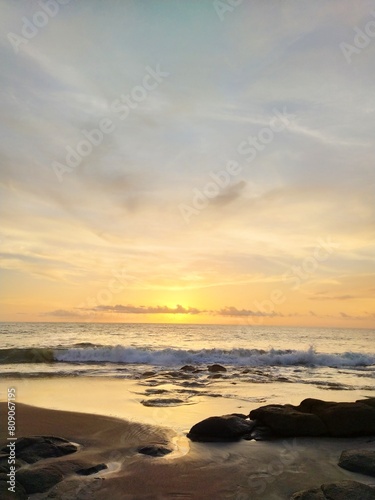 Yellow-orange sunset and sunrise on the ocean shore  Bali island. Epic sunrise  sandy beach. Landscape of Indonesia