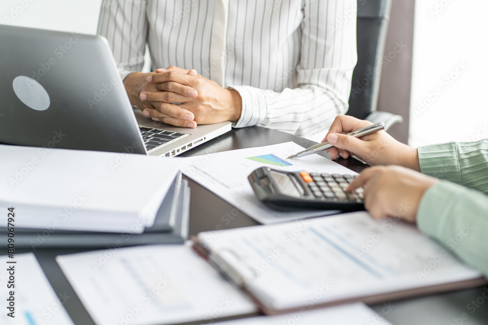 Auditor or internal revenue service staff, Business women checking annual financial statements of company. Audit Concept Auditor or internal revenue service staff, Business women checking annual financial statements of company. Audit Concept