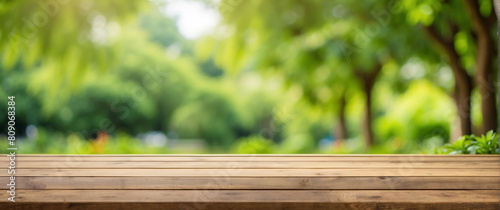 Wooden table and blurred green nature garden background.AI generated  