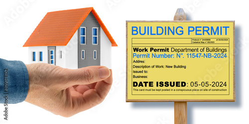 Fotografie Building Permit concept with home model and placard with imaginary work permit -