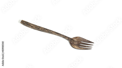Fork made from palm wood on white isolated