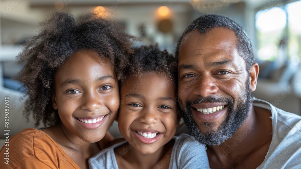 A happy family of three is smiling at the camera. A happy family of three is smiling at the camera.