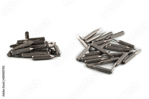 Isolated on a white background tips of a group of phillips head screwdriver bits. Top view. photo