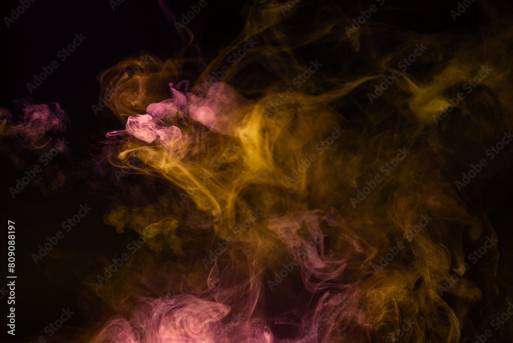 Yellow and pink steam on a black background. Yellow and pink steam on a black background.