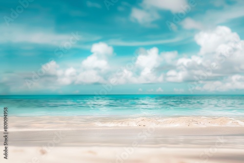 Crystal clear turquoise waters gently lapping against pristine white sandy beach under a clear sky