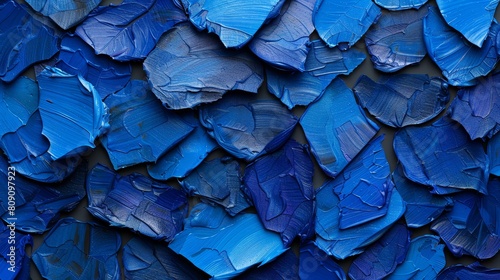  A detailed view of blue paint resembling a cluster of leaves on paper