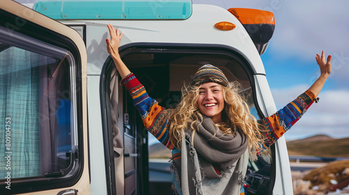 happy younh caucasian woman ready to conquer the day with her RV motorhome, off-grid lifestyle, vacations photo