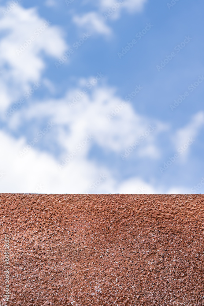 Naklejka premium polyurethane foam wall texture with blur blue open sky background.