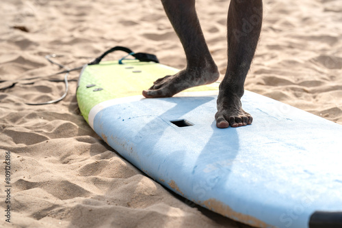 Photography An example position of Asian professional feet on a surfboard in surfing board lesson study and training by the teacher