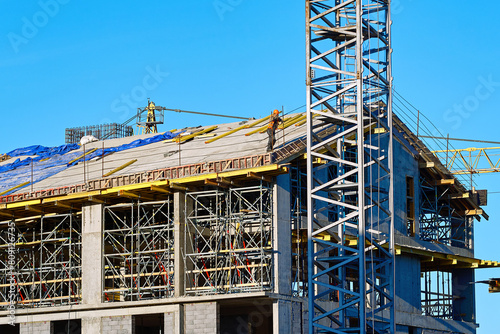 Сonstruction of multi-story building with formwork in place, сast-in-place and monolithic construction techniques used to create solid building structure. Formworks and iron rebars