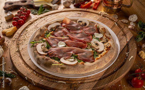 Delicious pizza with prosciutto and mushrooms