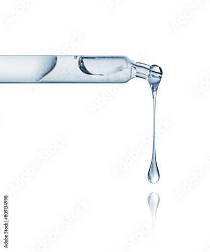 Cosmetic or medical pipette with dripping drops close-up on a white background
