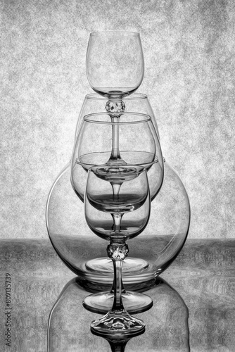 Still life with glassware on a reflective surface
