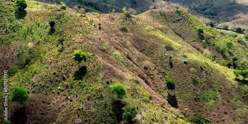 aerial video of deforested forests in mountainous areas being converted into agricultural land