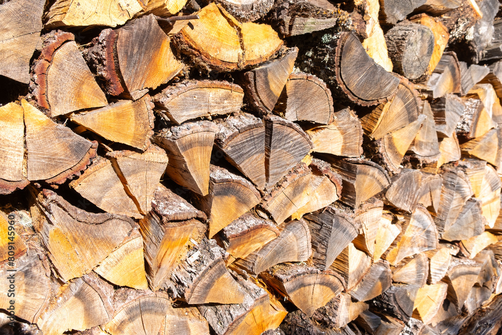 cut and stacked oak firewood, textured firewood background cut and stacked oak firewood, textured firewood background