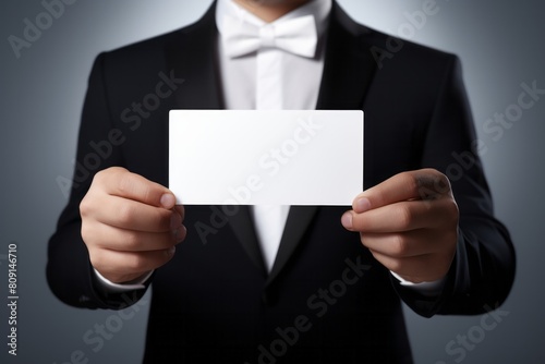 Elegant Man Presenting Blank Card