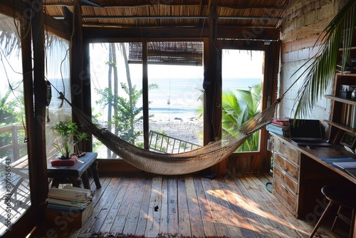 A hammock in a room with an ocean view  offering a relaxing spot for quick naps or moments of relaxation  A beachside office with a hammock for quick naps