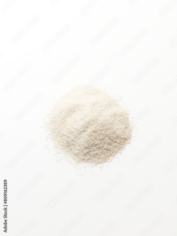 Isolated Celtic Gray Sea Salt On White Background, Vertical Plane. Top View. Natural And Unrefined Salt Harvested From Brittany, France. Superfood, Dieting. Natural Minerals And Trace Elements