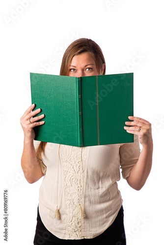 Hidding her face behind a book