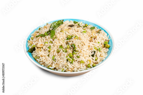 A dish of Indian or Asian white rice with cilantro, spices and green peas isolated on white