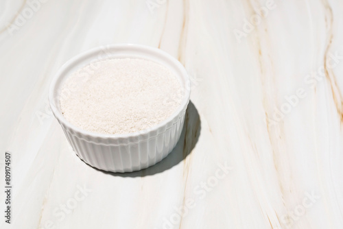 Celtic Gray Sea Salt In A White Ceramic Bowl On Granite Table, Copy Space. Horizontal Plane. Natural, Unrefined Salt Harvested From Brittany, France. Natural Minerals And Trace Elements, Superfood