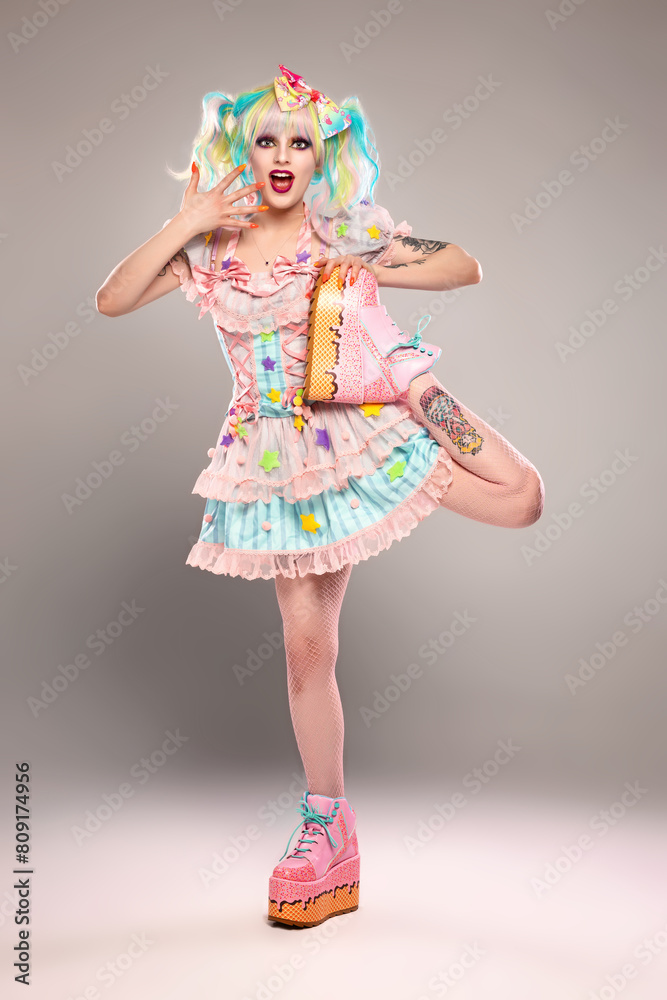 Pretty female clown model in colorful outfit and hair Pretty female clown model in colorful outfit and hair