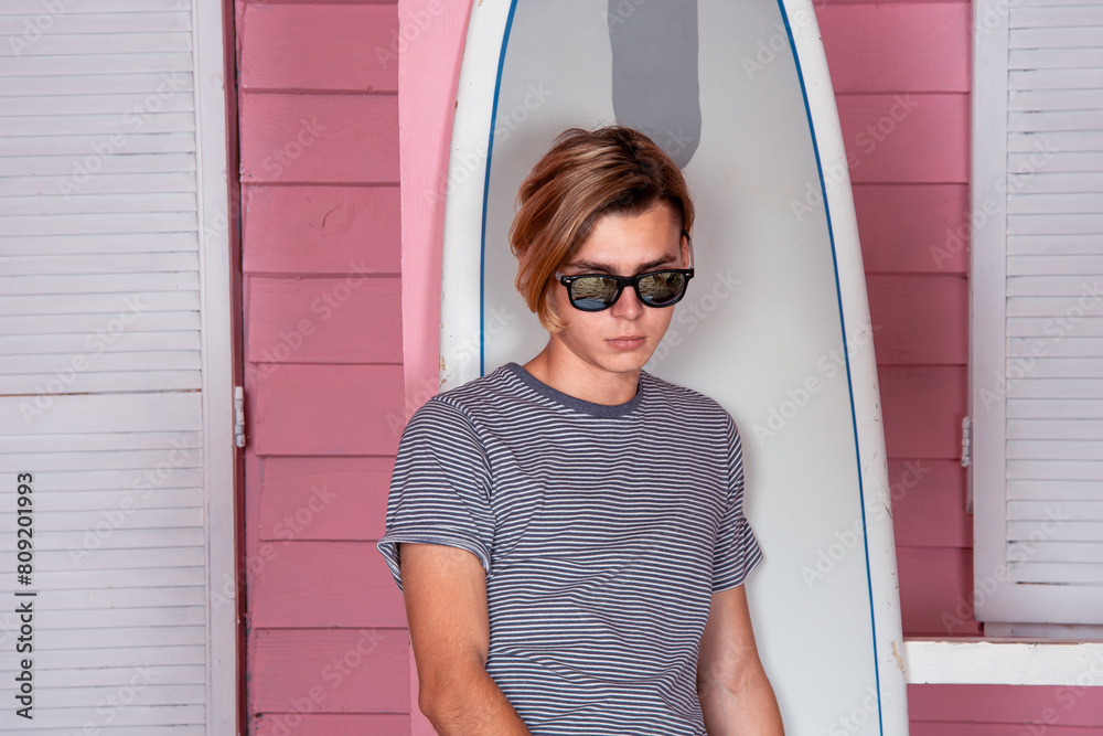 Sea, beach and vacation. A young attractive man is relaxing near his bungalow. Sea, beach and vacation. A young attractive man is relaxing near his bungalow.