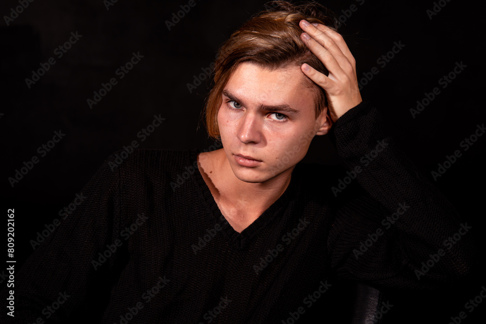 Sad young attractive man relaxing at home. Sad young attractive man relaxing at home.
