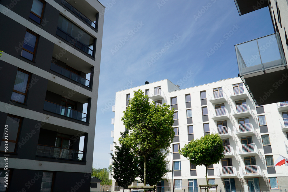 Modern multistorey buildings with balconies and trees Modern multistorey buildings with balconies and trees