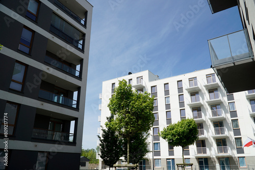 Modern multistorey buildings with balconies and trees