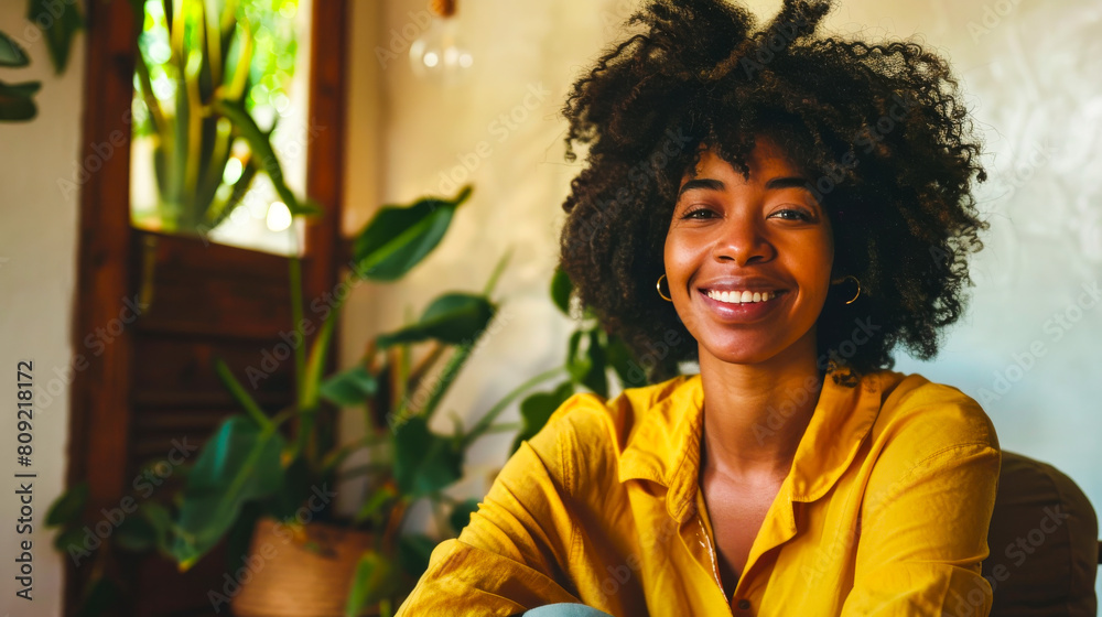 Cheerful Young African American Woman Sitting in Chair
Cheerful Young African American Woman Sitting in Chair
